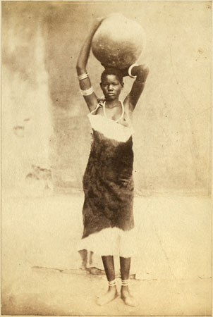 Shilluk woman holding jar