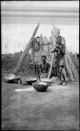 Nuer women preparing food