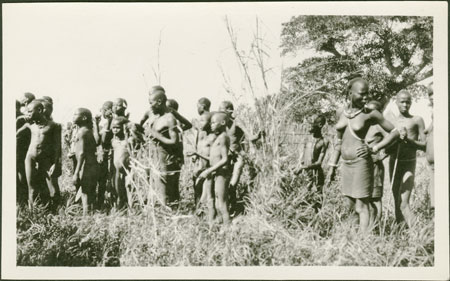 Nuer group on riverbank