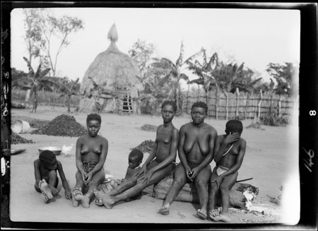Zande women and children in homestead.