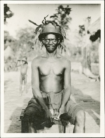 Zande man wearing feathered hat