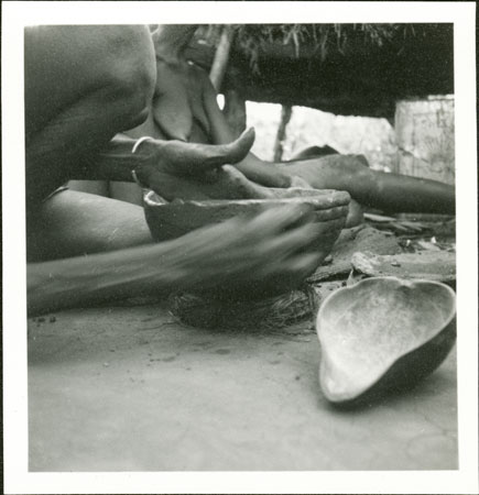 Anuak woman pot-making