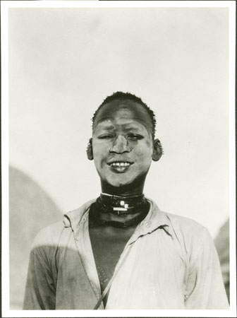 Nuer youth with ash face decoration