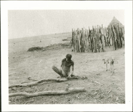 Nuer man making cord