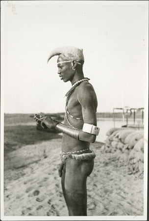 Nuer youth with thiau arm-rings 