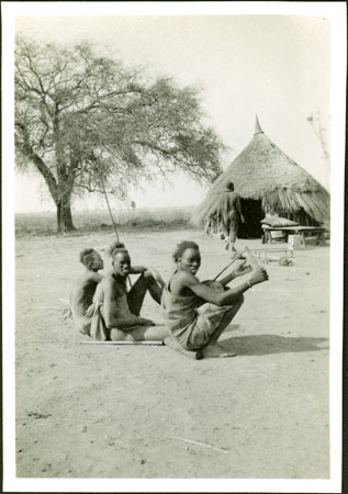 Shilluk man playing lyre