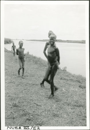 Nuer youths washing 