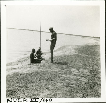 Nuer youths beside river