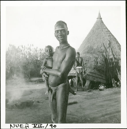 Nuer man with baby