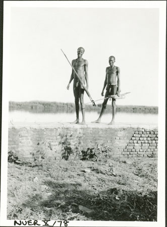Nuer men on wall