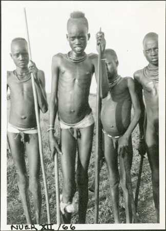 Nuer youths with harpoons
