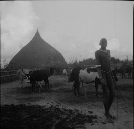 Nuer man in homestead