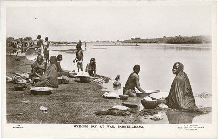 Washing clothes in river at Wau