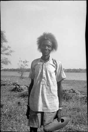 Mandari man with headdress and shield