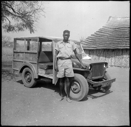Mandari youth with jeep