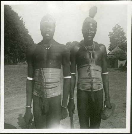Two Mandari men wearing beads