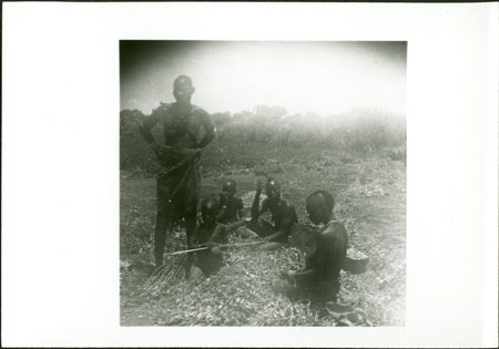Mandari women preparing groundnuts