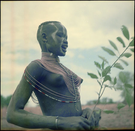 Mandari girl wearing bead necklet