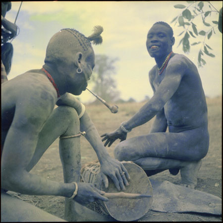 Mandari youths playing drums