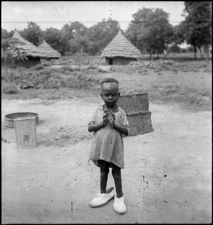 Dinka child in homestead