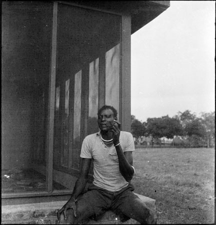 Portrait of a Dinka man with pipe