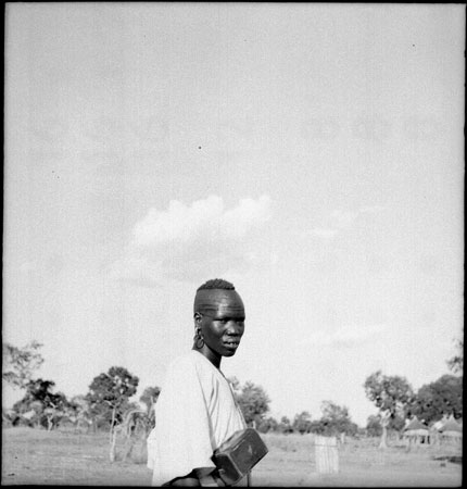 Dinka youth with camera case