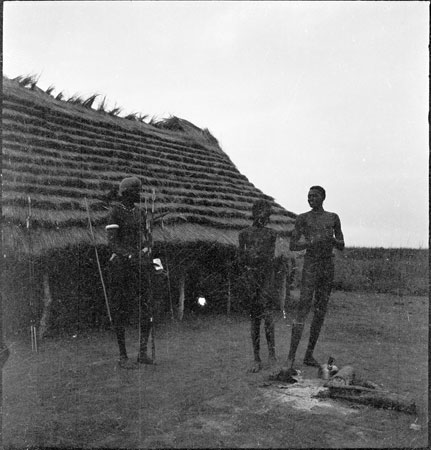 Dinka youths outside a building