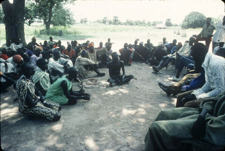 Dinka people in shade of a tree