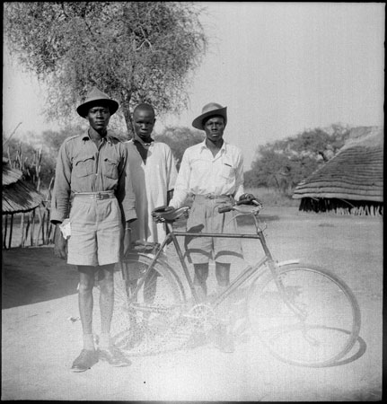 Dinka men with bicycle
