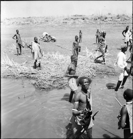 Shilluk people on river bank