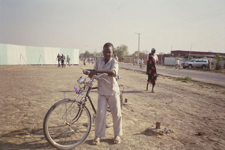 Shilluk boy with bicycle