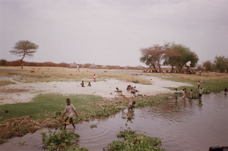 Nuer children playing near river