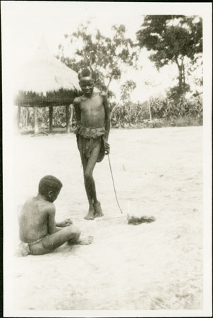 Zande boy making net trap