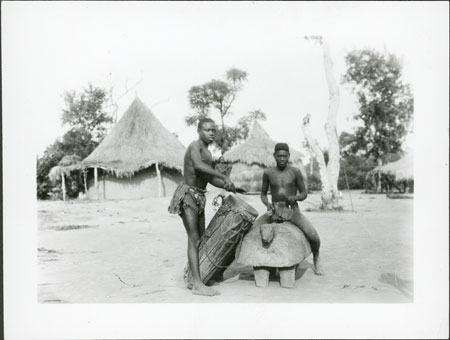 Zande youths with drum and gong