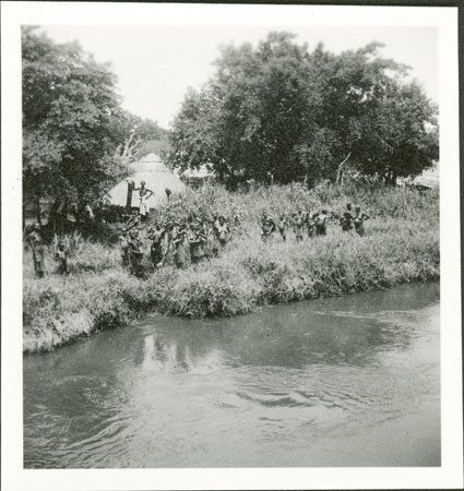 Anuak women on riverbank