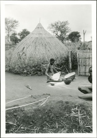 Anuak woman in homestead