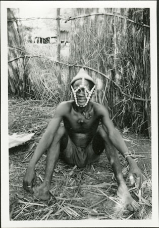 Anuak man in headdress