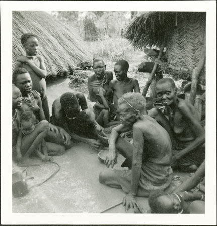 Anuak woman pot-making