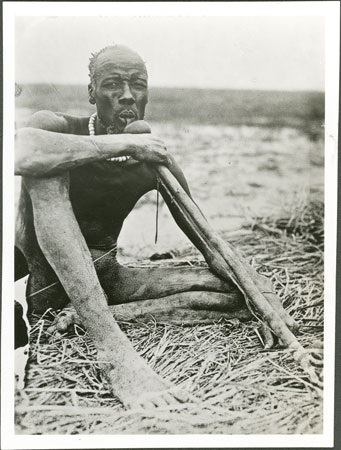 Nuer man smoking pipe