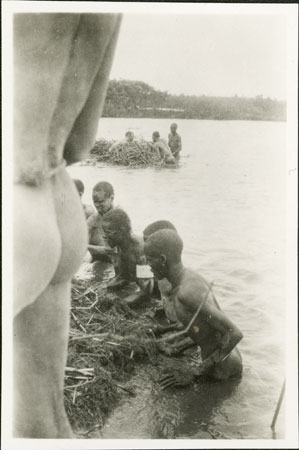 Nuer men in river