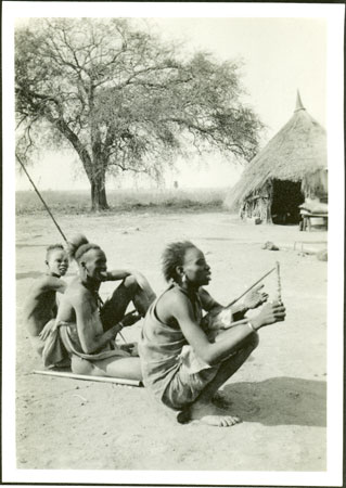 Shilluk man playing lyre