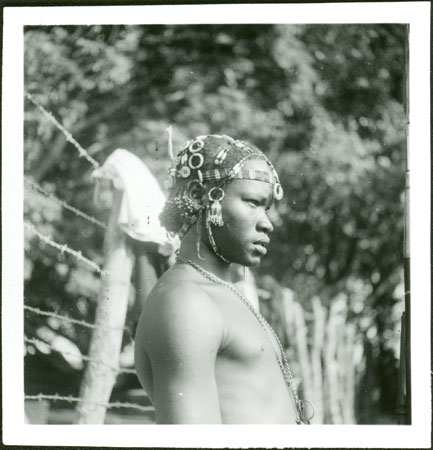 Mandari youth with bead hair ornaments