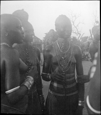 Mandari girl wearing bead ornaments