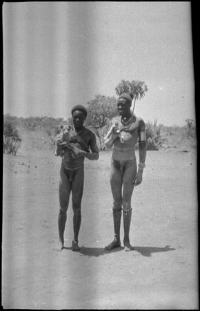 Mandari men wearing beads