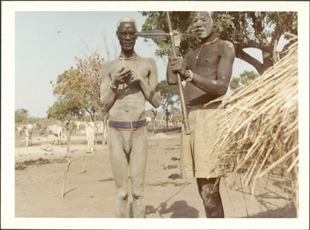 Mandari youth with spear and club