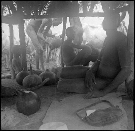 Mandari youths in cattle camp shelter