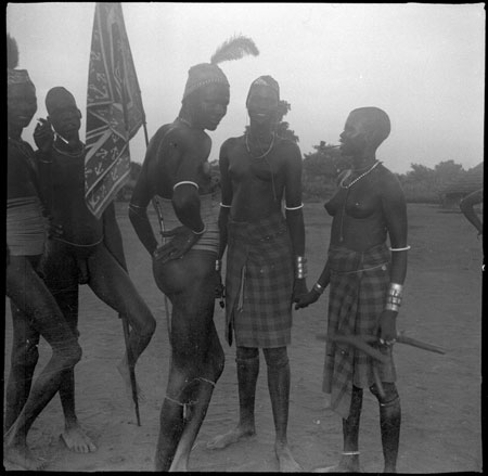 Mandari youth with flag at dance