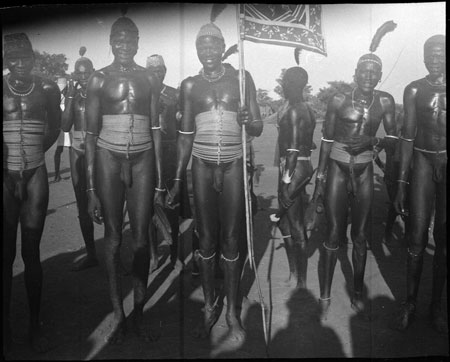 Mandari youths with flag at dance