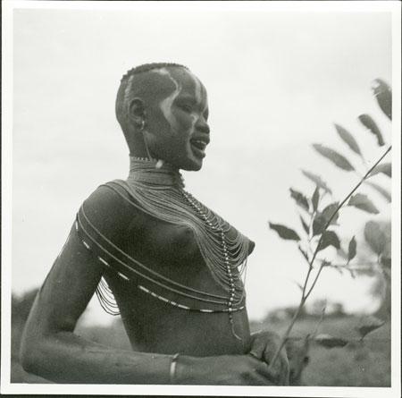 Mandari girl wearing bead necklet