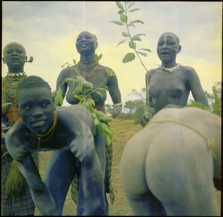 Mandari girls singing with switches 